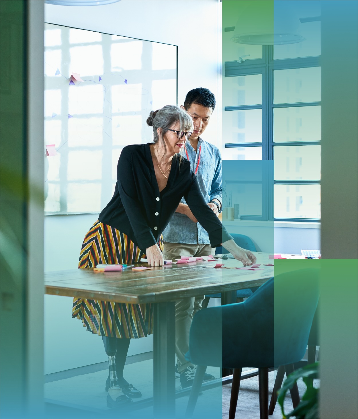 Office workers in a planning session with sticky notes